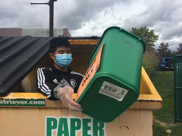 Sophomore Patrick Li collects bins of paper from fellow recycling club members to empty out into the main paper dumpster. While the majority of clubs have transitioned to conducting fully virtual meetings, there are a handful of activities that continue to offer in-person events. However, following Governor Whitmer’s most recent announcement, all clubs and sports have been required to discontinue in-person activity.