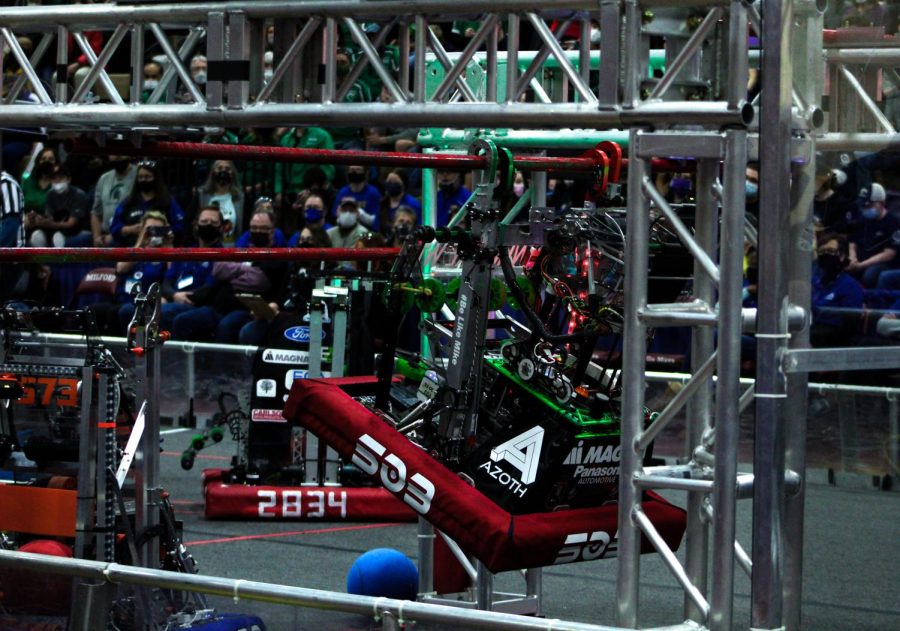 Team 503s robot climbs up the bars to hit the highest point for full scoring. The higher the robot reaches on the bars, the more points they earn for their team.