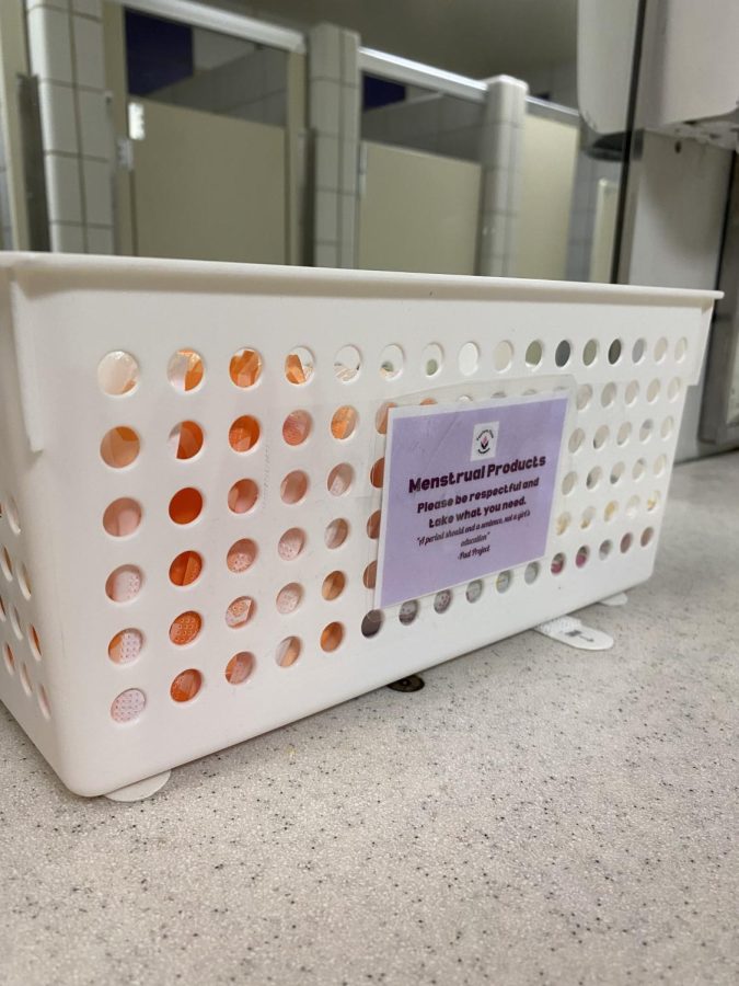 One of the free menstrual product boxes located in the women’s bathroom near the performance hallway. Tampons and pads of various sizes and flow levels are offered inside each container for students to take when needed.