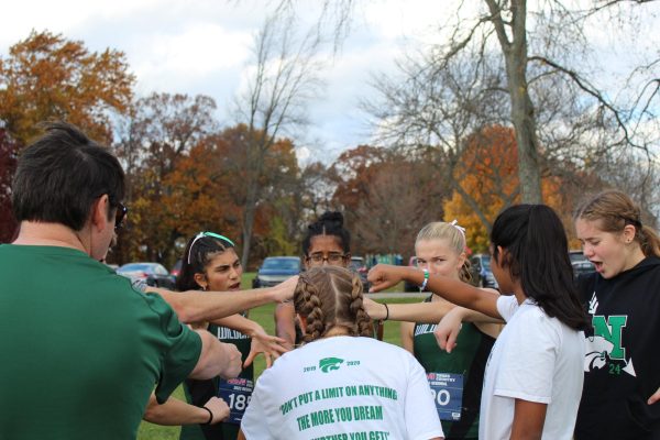 The team huddles together to do a team cheer before racing at Kensington Metropark for the Regional meet. The team placed 4th out of 14 teams, and freshman Kareena Babu individually qualified for the state meet on Saturday, November 4th. 